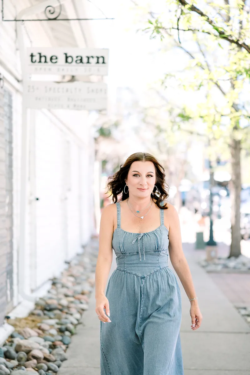 Jessica Lentz walking past The Barn shops in downtown Castle Rock
