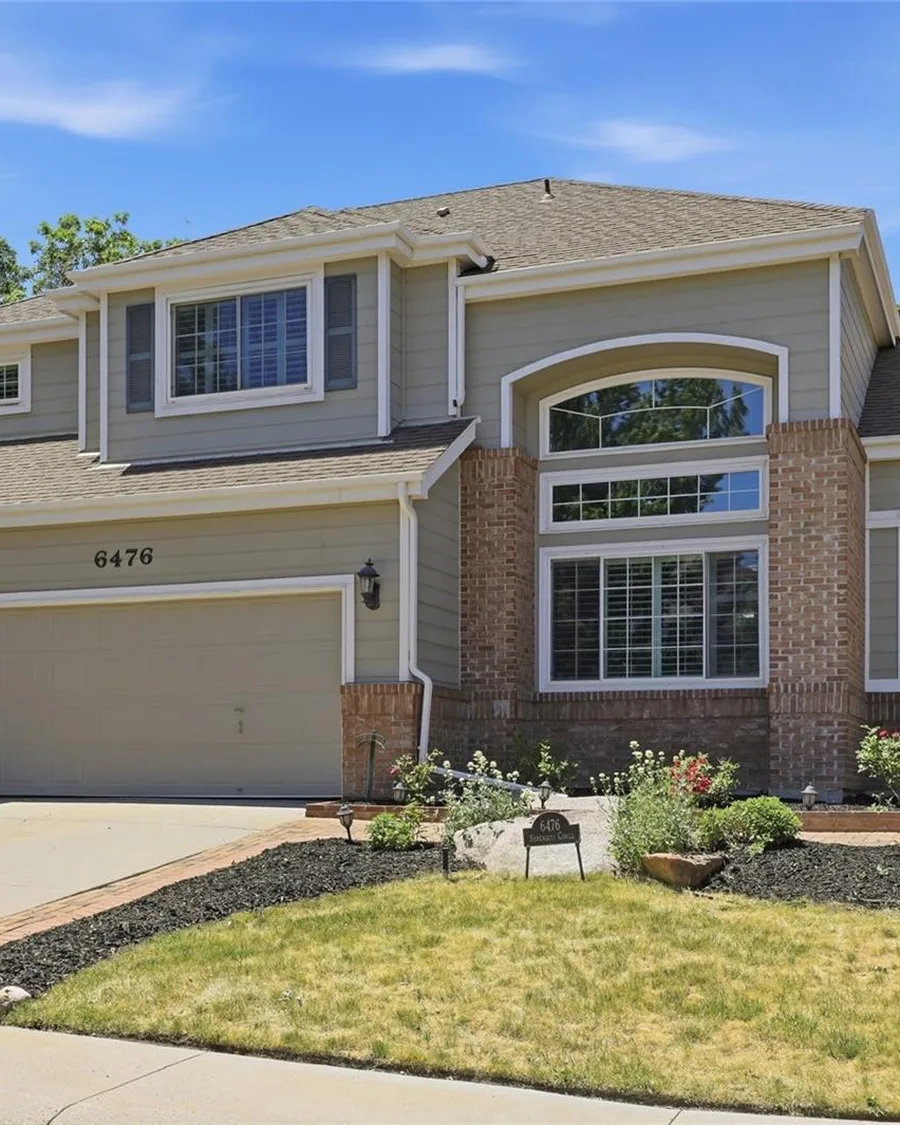 Front of a two-story brick and siding home in Lone Tree, one of Jessica's listings