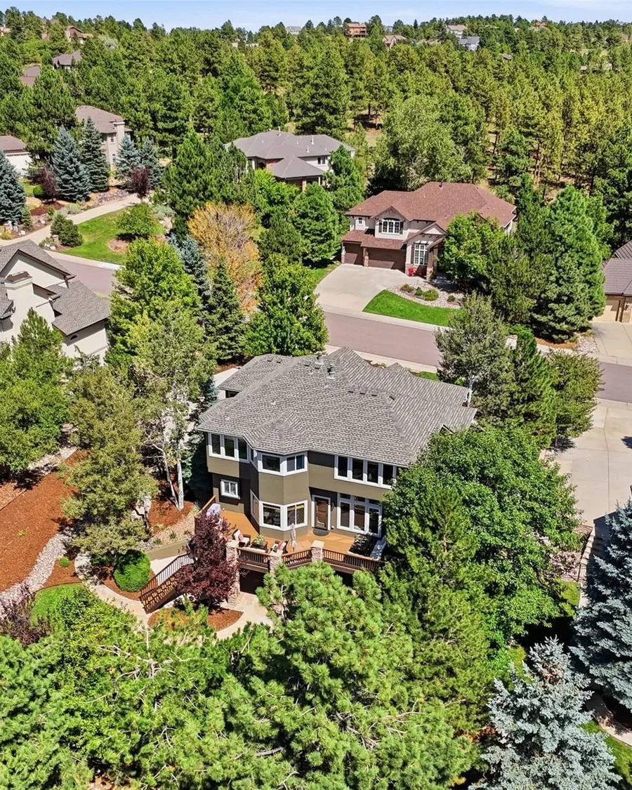 Two-story home on a wooded lot among tall pines in Parker, one of Jessica's listings